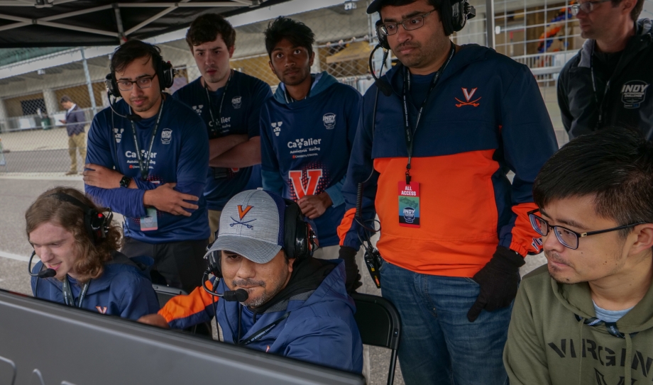 members of the UVA Cavalier Autonomous Racing team at the track