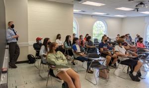 students sitting in desks during seminar