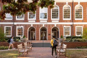 Front view of Thornton hall with students walking toward the entrance