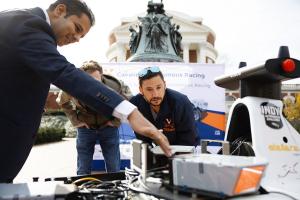 Madhur Belh and CART members with car at Rotunda