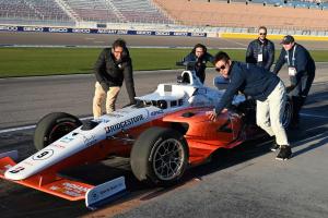Cavalier Autonomous Racing Team members push robot car into position