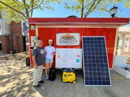 UVA student and staff in front of Sombrero's food truck