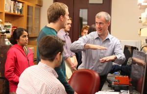 Brian Helmke teaching students in the lab