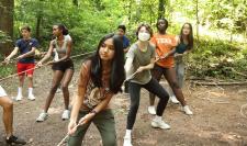 students working together to pull a rope