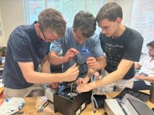 students fixing coffee machine