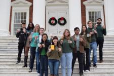 Green labs certification picture with lab members standing in a V shape on the Rotunda steps