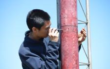 Young man using a screwdriver