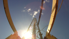 View of a rocket launching from the pad from the ground looking up